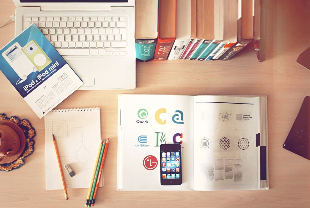 Sed sodales erat ac velit 1 Pencils and phone on top of books