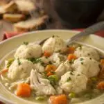 Crockpot Chicken and Dumplings Recipe is the ultimate comfort food with tender chicken, fluffy dumplings, and creamy broth. Try it today!